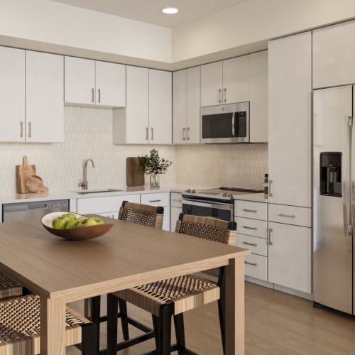 a kitchen with white cabinets