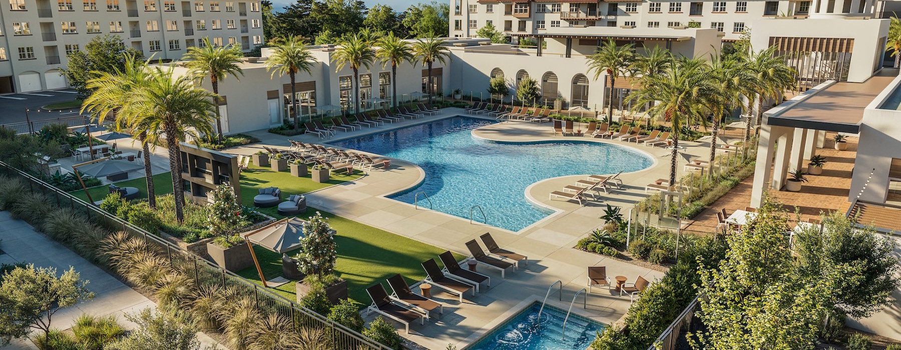 an aerial view of a courtyard with a swimming pool