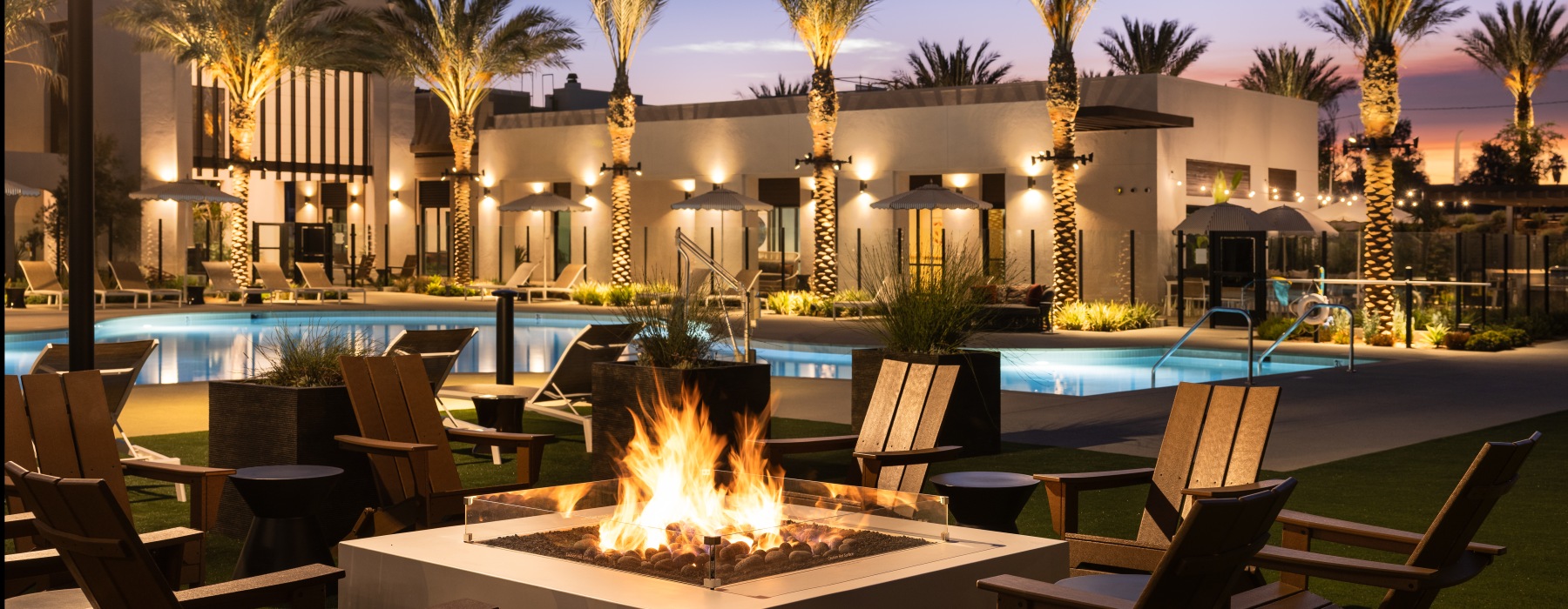 A fire pit with chairs at Montessa Heights apartments